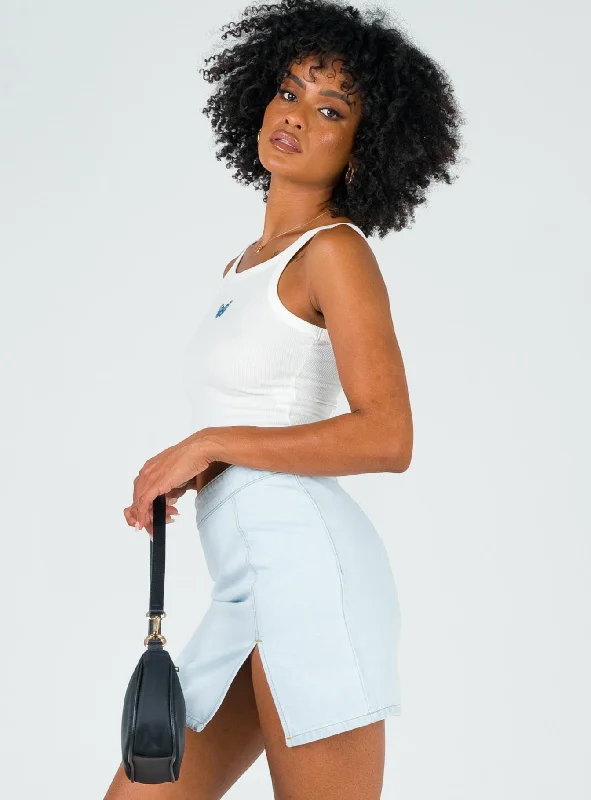 The Lola Mini Skirt Light Wash Denim The Lola Mini Skirt Light Wash Denim